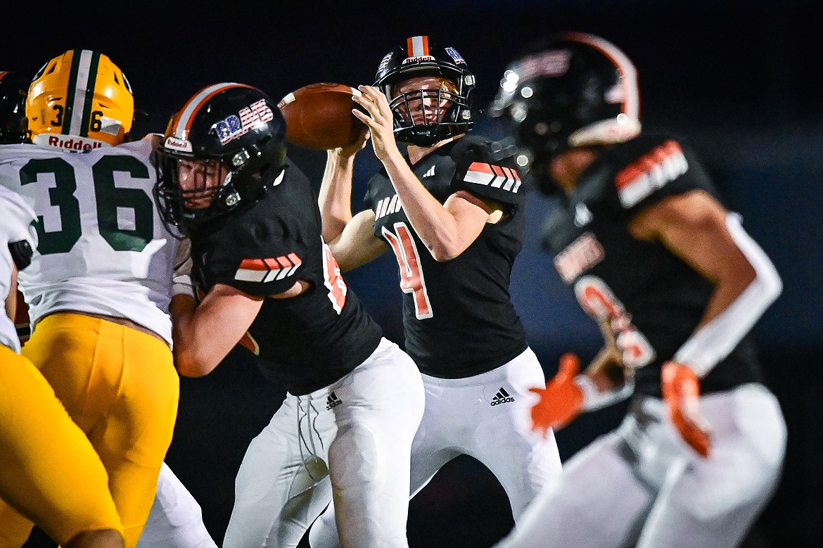 Flathead quarterback Brett Pesola (4) looks to throw in the second half against Great Falls CMR at Legends Stadium on Friday, Aug. 30. (Casey Kreider/Daily Inter Lake)