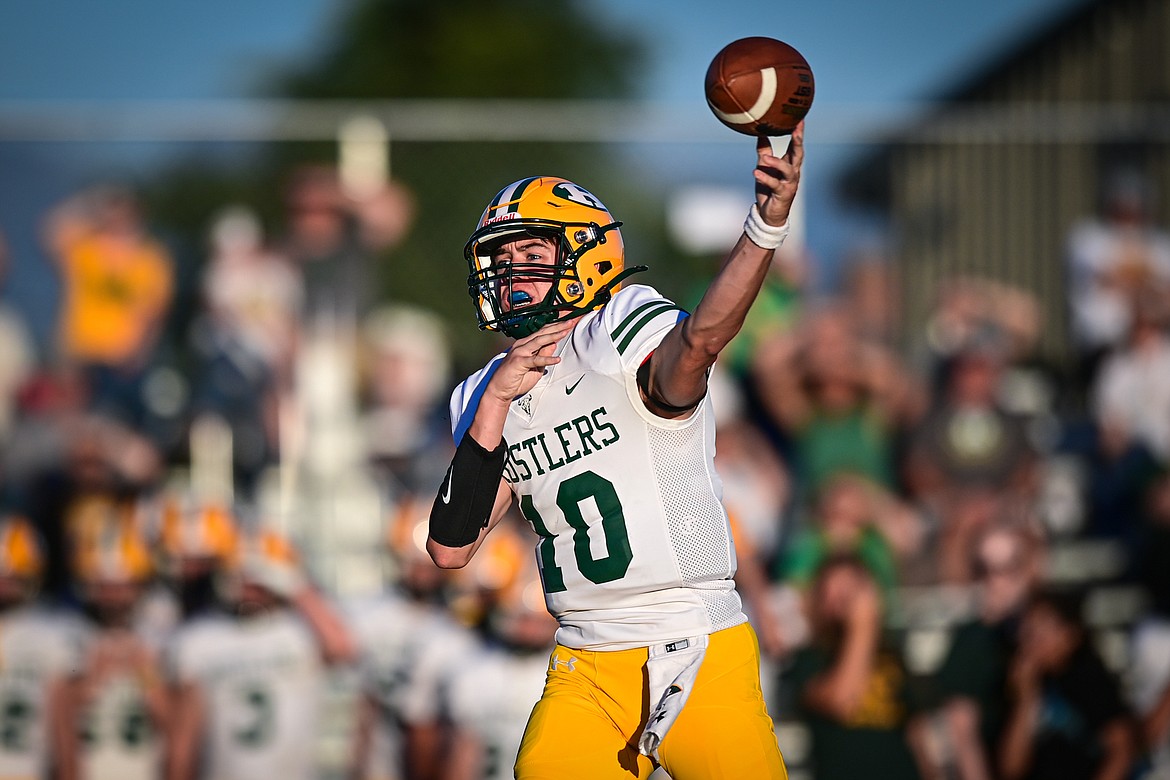 Great Falls CMR quarterback Caleb Taylor (10) drops back to pass against Flathead at Legends Stadium on Friday, Aug. 30. (Casey Kreider/Daily Inter Lake)