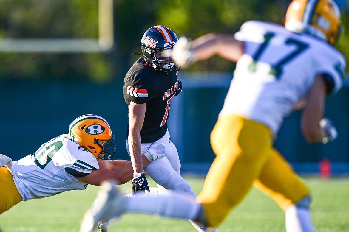 Flathead wide receiver Will Hollensteiner (7) looks for running room after a handoff in the second quarter against Great Falls CMR at Legends Stadium on Friday, Aug. 30. (Casey Kreider/Daily Inter Lake)