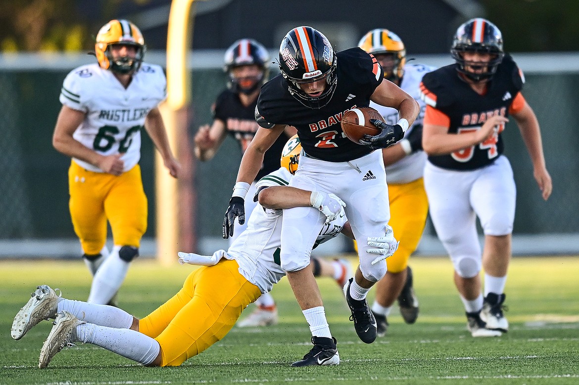 Flathead running back Nolan Campbell (24) picks up yardage on a run against Great Falls CMR at Legends Stadium on Friday, Aug. 30. (Casey Kreider/Daily Inter Lake)