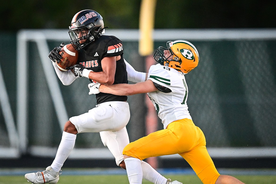 Flathead running back Tim Zundel (0) looks for running room against Great Falls CMR at Legends Stadium on Friday, Aug. 30. (Casey Kreider/Daily Inter Lake)