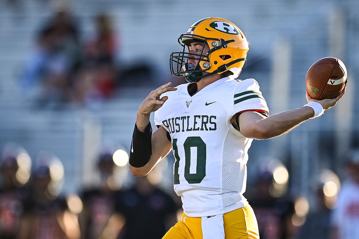 Great Falls CMR quarterback Caleb Taylor (10) drops back to pass against Flathead at Legends Stadium on Friday, Aug. 30. (Casey Kreider/Daily Inter Lake)