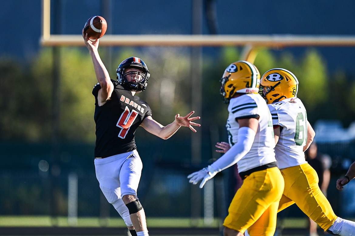 Flathead quarterback Brett Pesola (4) rolls out to pass in the first quarter against Great Falls CMR at Legends Stadium on Friday, Aug. 30. (Casey Kreider/Daily Inter Lake)