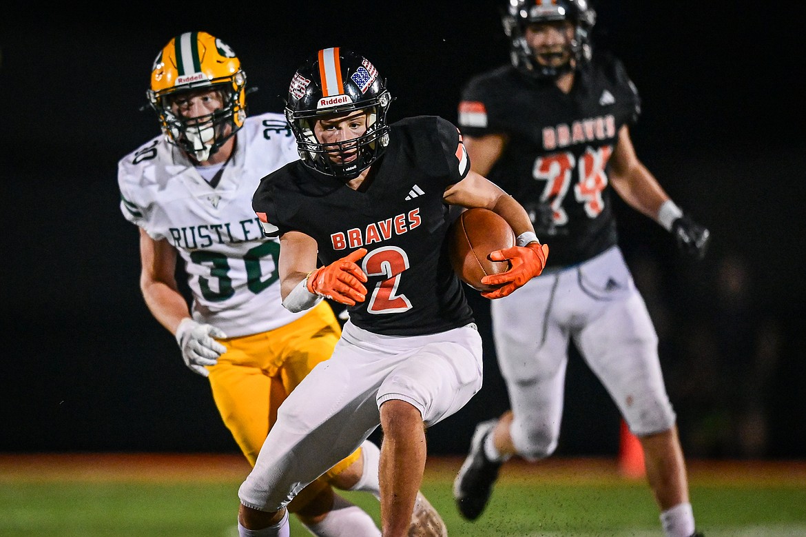 Flathead wide receiver Ben Bliven (2) picks up yardage in the second half against Great Falls CMR at Legends Stadium on Friday, Aug. 30. (Casey Kreider/Daily Inter Lake)