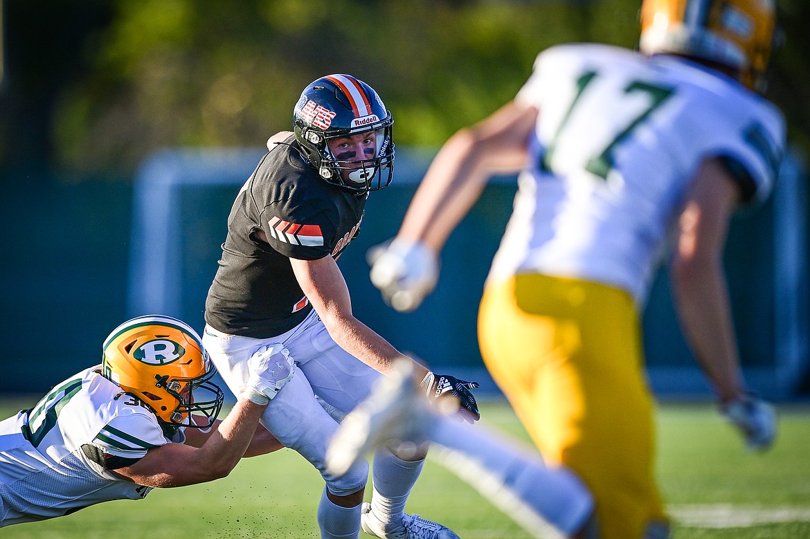 Flathead wide receiver Will Hollensteiner (7) looks for running room after a handoff in the second quarter against Great Falls CMR at Legends Stadium on Friday, Aug. 30. (Casey Kreider/Daily Inter Lake)