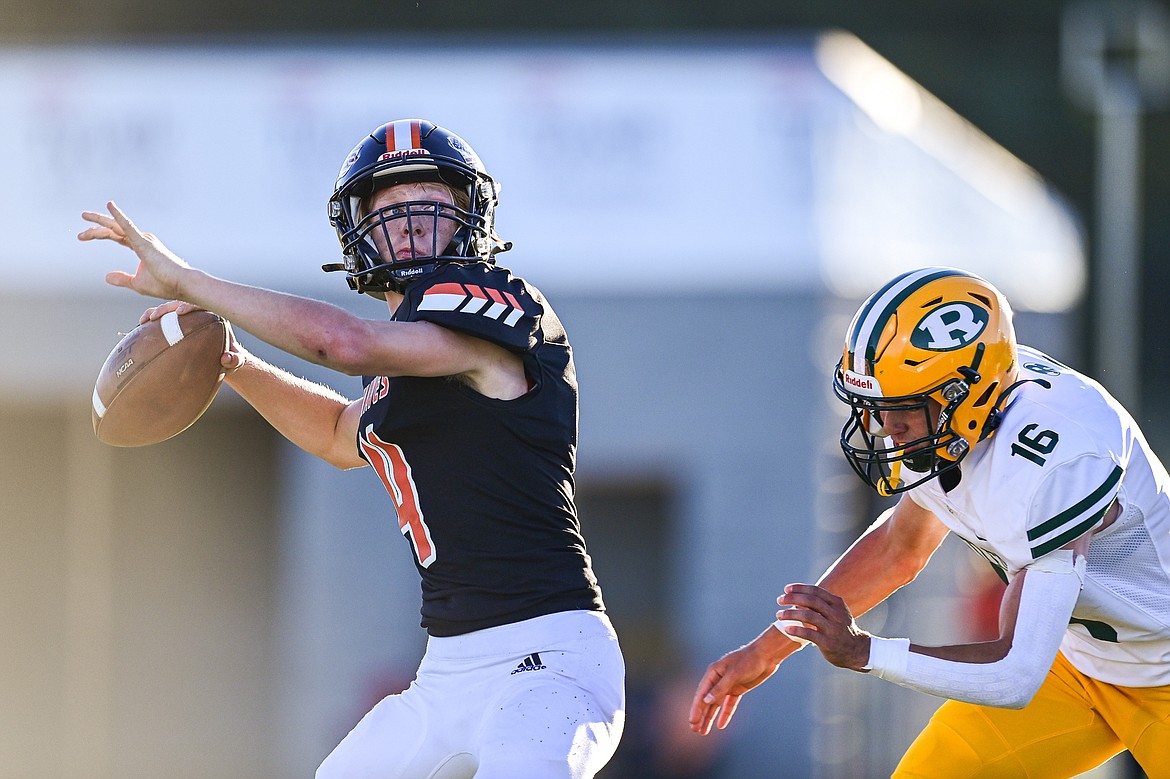 Flathead quarterback Brett Pesola (4) rolls out to pass in the first quarter against Great Falls CMR at Legends Stadium on Friday, Aug. 30. (Casey Kreider/Daily Inter Lake)