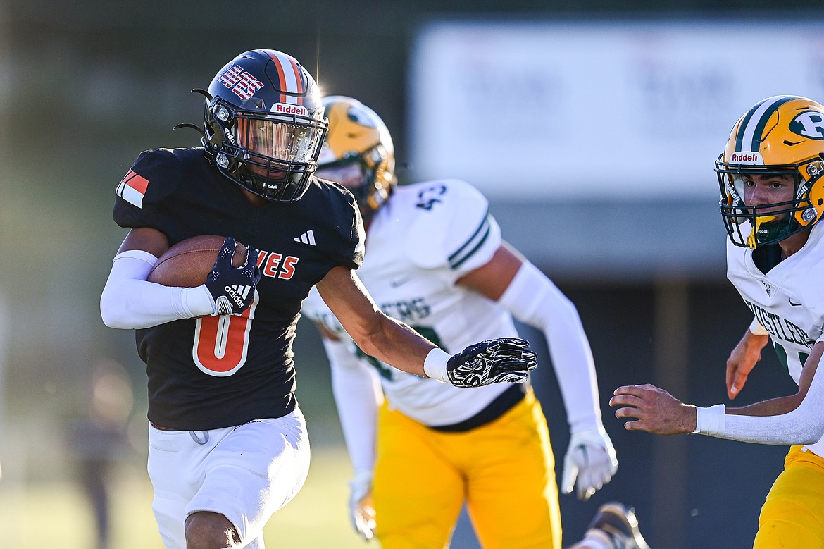 Flathead running back Tim Zundel (0) looks for running room against Great Falls CMR at Legends Stadium on Friday, Aug. 30. (Casey Kreider/Daily Inter Lake)