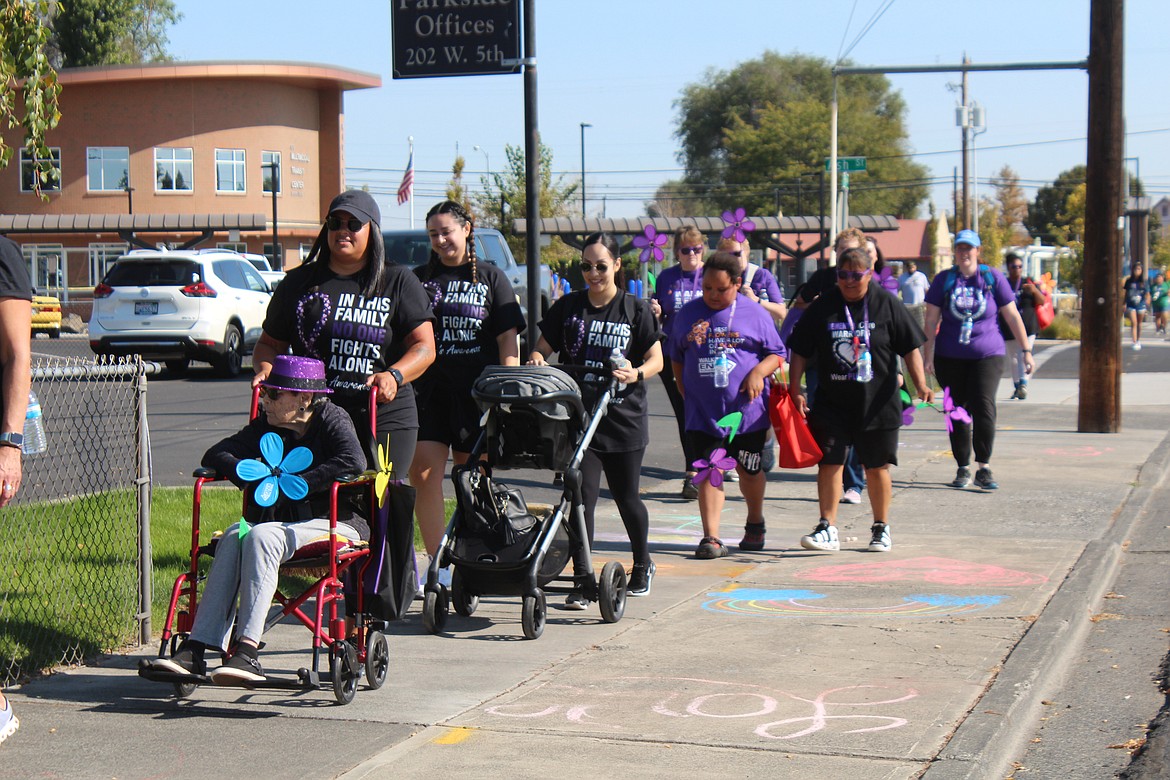 Walkers take to the street for last year’s Walk to End Alzheimer’s. This year’s walk is Sept. 14.