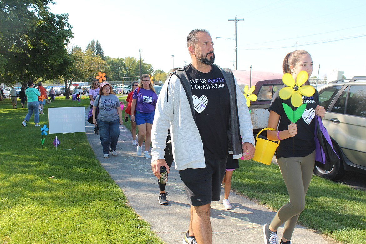 A walker’s T-shirt shows why he’s participating in the Walk to End Alzheimer’s last year. This year’s event is Sept. 14.