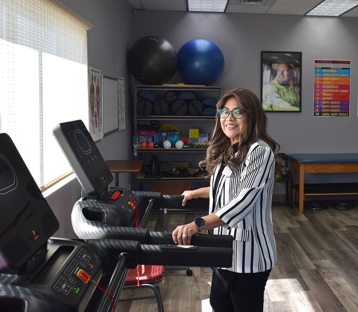 Pacific Rehabilitation Centers’ Administrative Assistant Erika Garza shows one of the treadmills in the clinic’s physical therapy department. Most of the physical therapy the clinic does is exercises tailored to the individual patient’s injuries.