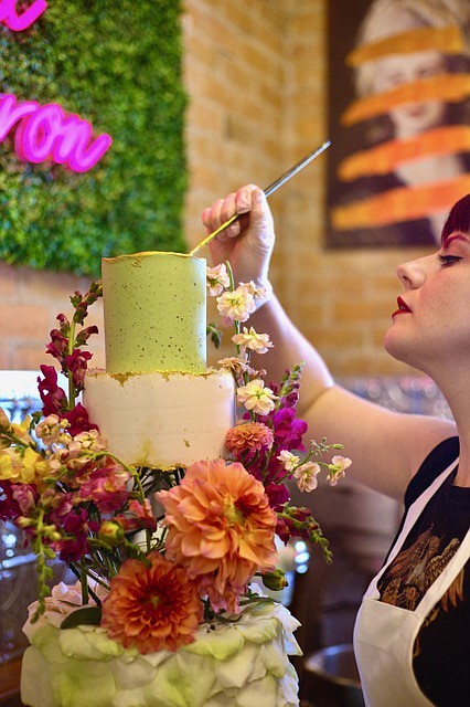 Aurora Darling decorates a cake at Ephemera Confection in Kalispell. (Laura Cody-Ferguson photo)