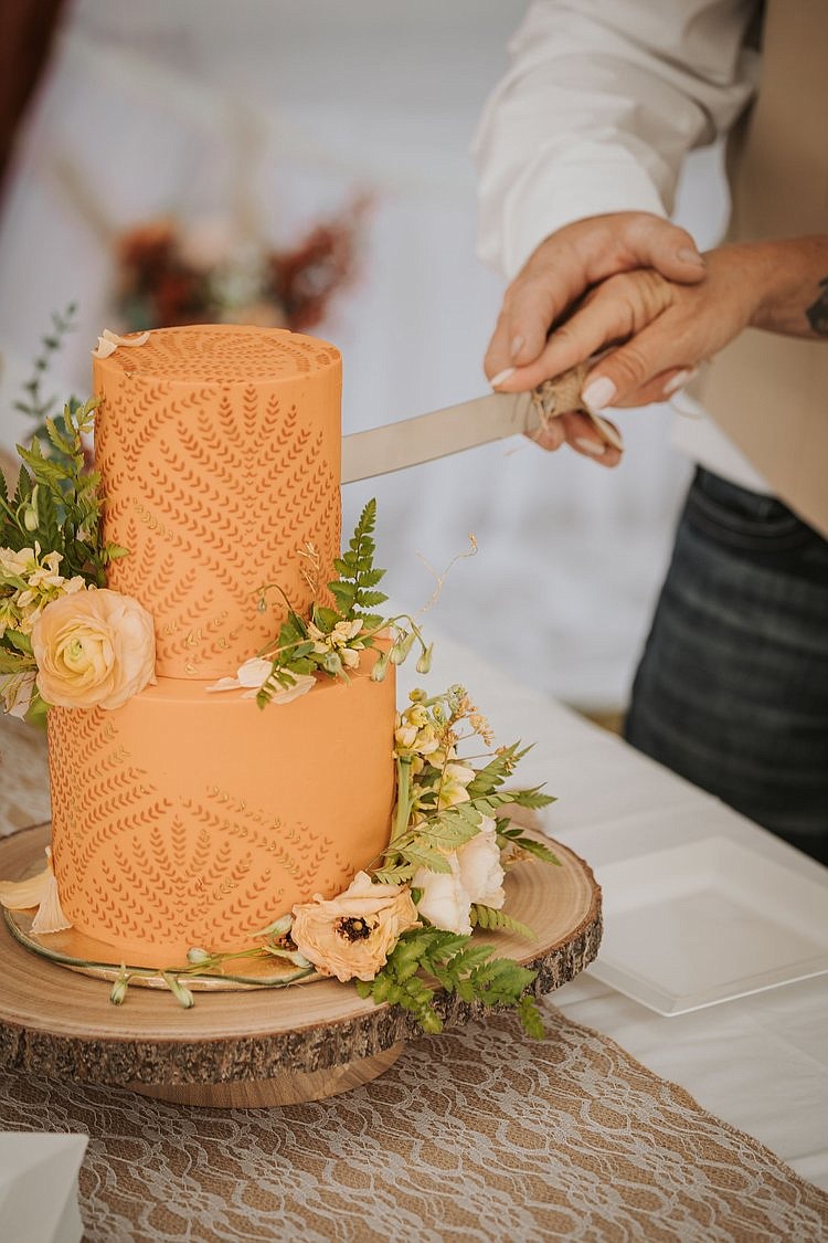 People slice into a cake by Ephermera Confection on Main Street in downtown Kalispell. (Photo provided)