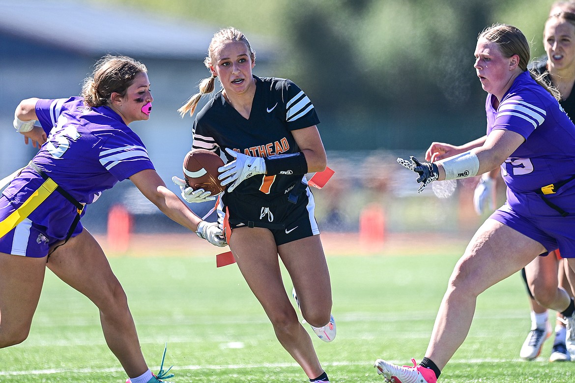 Flathead's Avory Galey (7) picks up yardage after a reception in the first half against Butte at the Kalispell Jamboree at Legends Stadium on Saturday, Aug. 31. (Casey Kreider/Daily Inter Lake)