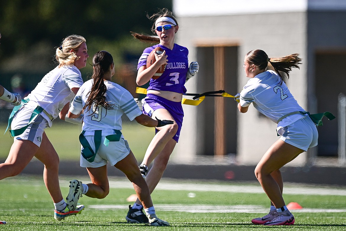 Glacier's Zeila Wagner (29), Khirsten Terrell (9) and Breanna Barnes (2) stop Butte's Sophie Radcliffe (3) in the first half at the Kalispell Jamboree at Legends Stadium on Saturday, Aug. 31. (Casey Kreider/Daily Inter Lake)