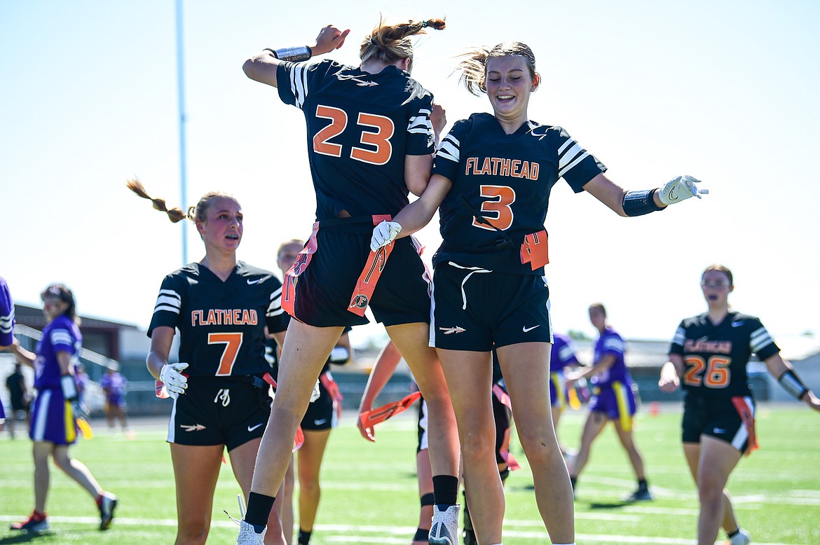 Flathead's Julia Kay (23) and Ava Malmin (3) celebrate after a touchdown by Kay against Butte at the Kalispell Jamboree at Legends Stadium on Saturday, Aug. 31. (Casey Kreider/Daily Inter Lake)