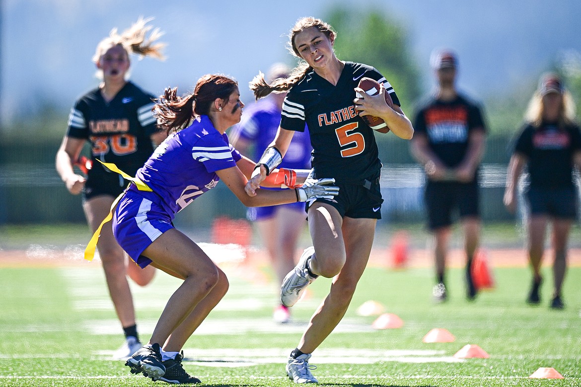 Flathead quarterback Kinsey Lake (5) runs for a big gain in the second half against Butte at the Kalispell Jamboree at Legends Stadium on Saturday, Aug. 31. (Casey Kreider/Daily Inter Lake)