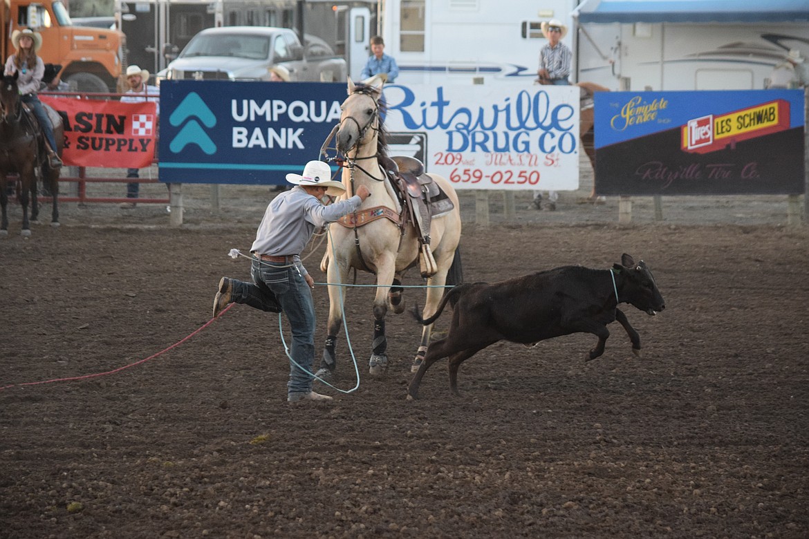 One of the calf ropers catches his calf at the Ritzville Rodeo Aug. 30.