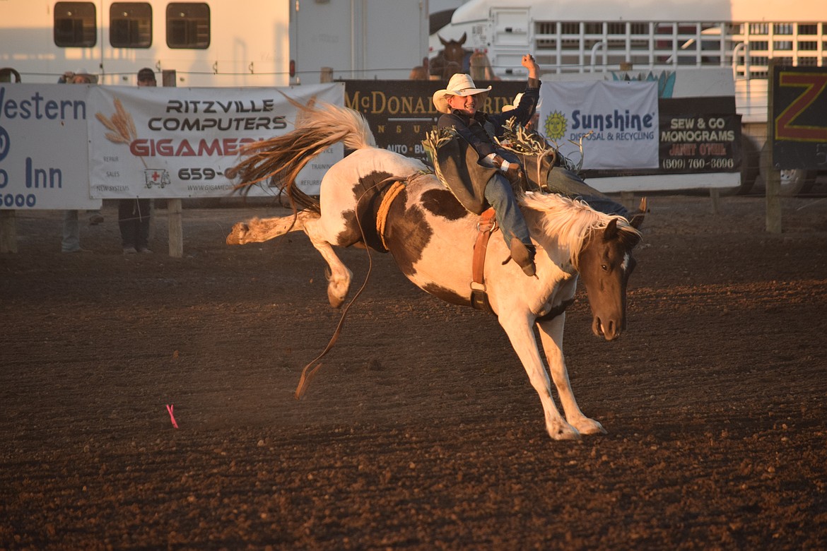 One of the bareback riders whips around on his horse at the Ritzville Rodeo on Aug. 30. There were only two qualifying riders for bareback at the Friday night rodeo.