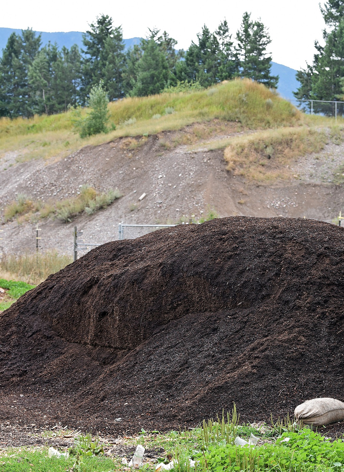 A pile of dark, rich compost is the final product at Dirt Rich Compost. (Julie Engler/Whitefish Pilot)