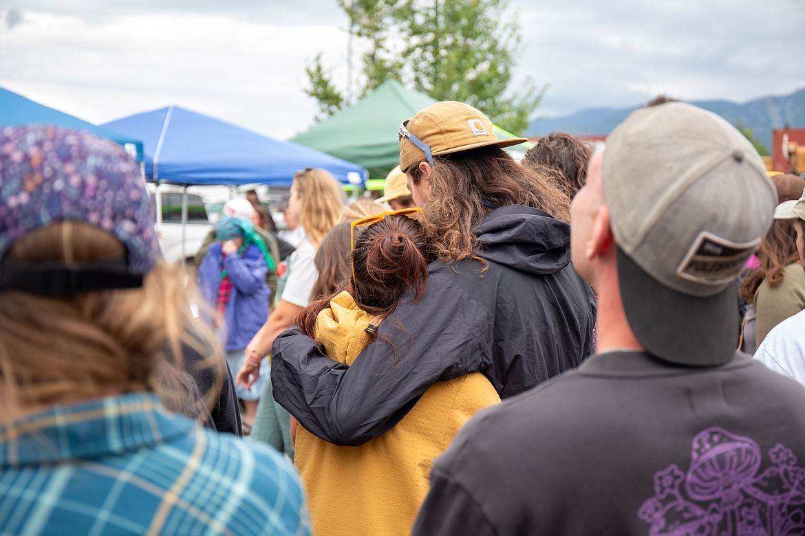 People console each other as they celebrate Grant Marcuccio's life. (Andrea Getts Photo)