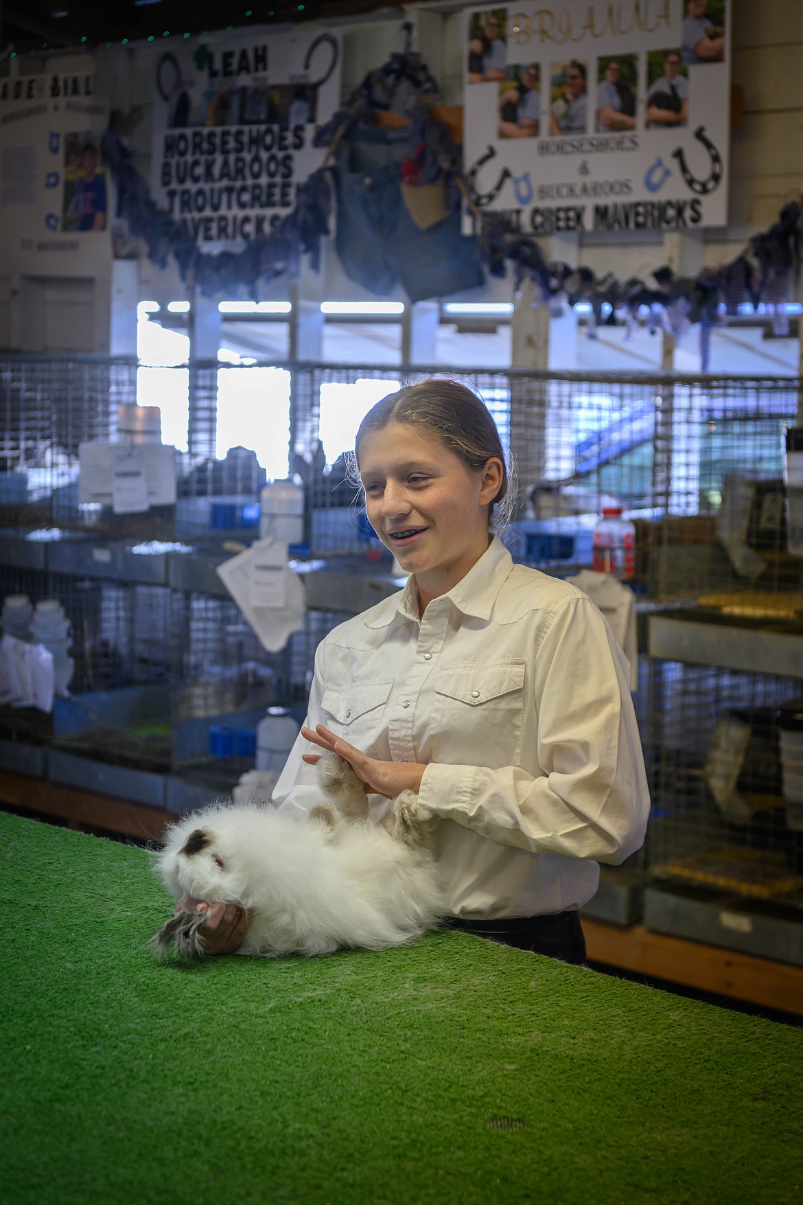 Katherine Wrobleski interviews with rabbit judge Melody Henault. (Tracy Scott/Valley Press)