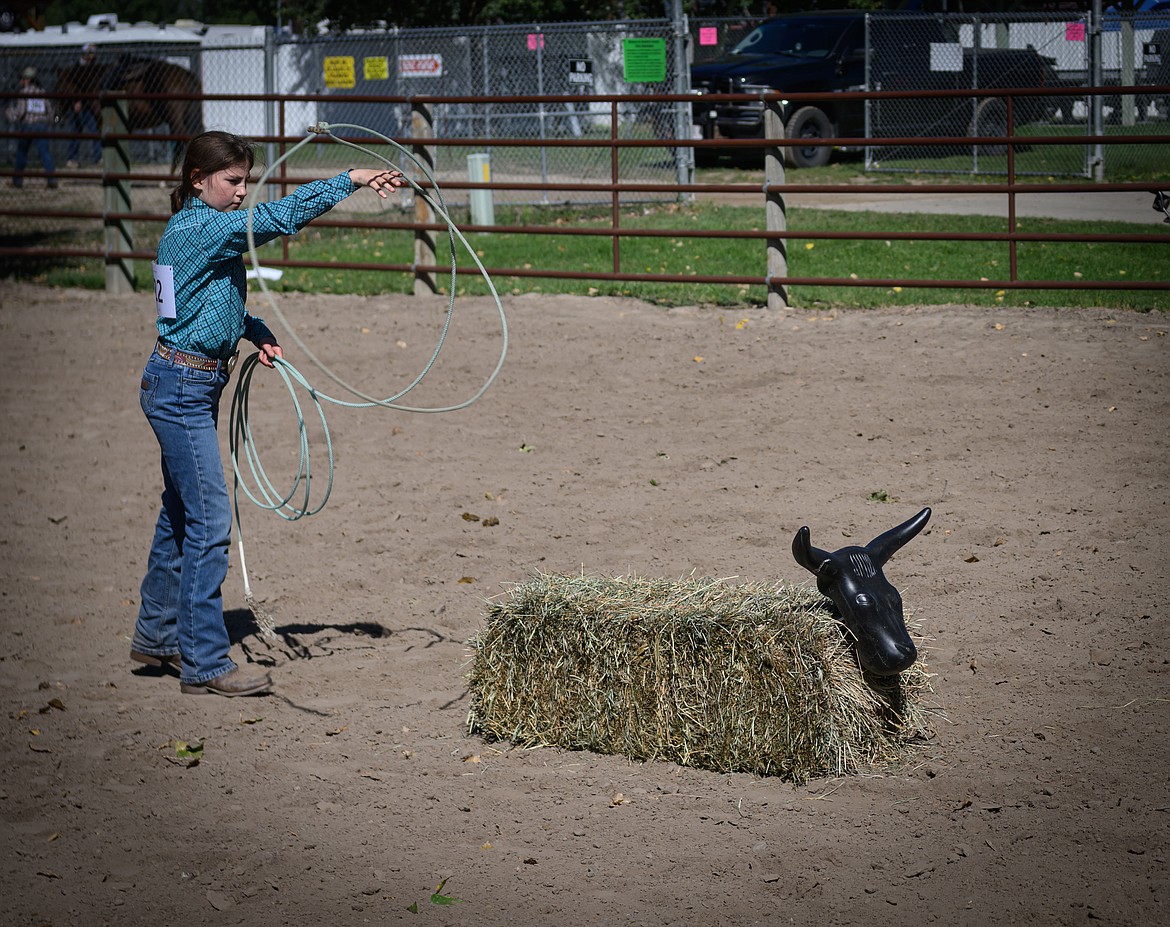 Lainey Erwin tries her hand at roping during the first 4-H horse show. (Tracy Scott/Valley Press)