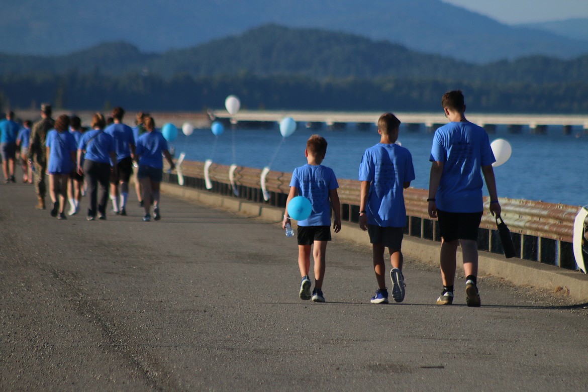 Walkers head back to Dog Beach as they take part in the Walk for HOPE on Sunday.