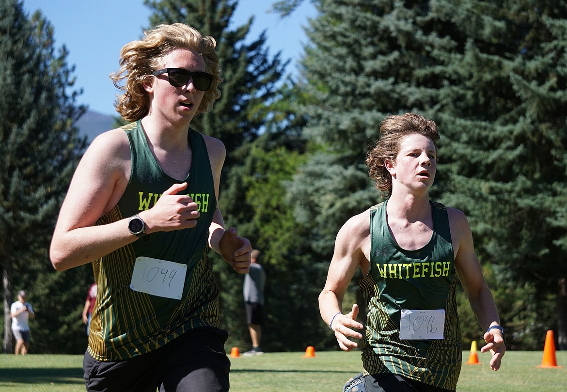 Junior Koru Larimore (left) and Freshman Luca Gignoux (right) competing in the men's junior varsity race in Libby on Friday. (Matt Weller Photo)