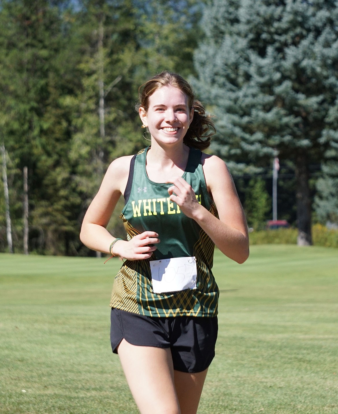 Junior Grace Kepler completing her first cross country race for the Green and Gold. (Matt Weller Photo)