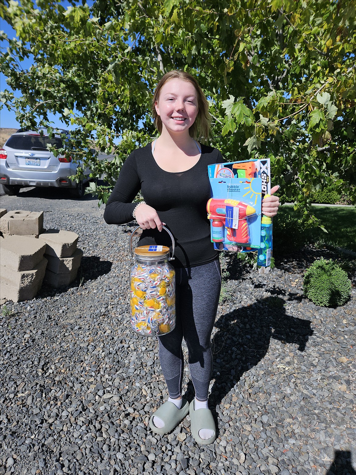 Kyra Kaler, 19, of Ephrata had the second-closest guess in the Grant County Democrats’ Count the Candy contest at the Grant County Fair. She received water and bubble guns and also the jar of candy, which was to bulky to mail to the first-place winner.