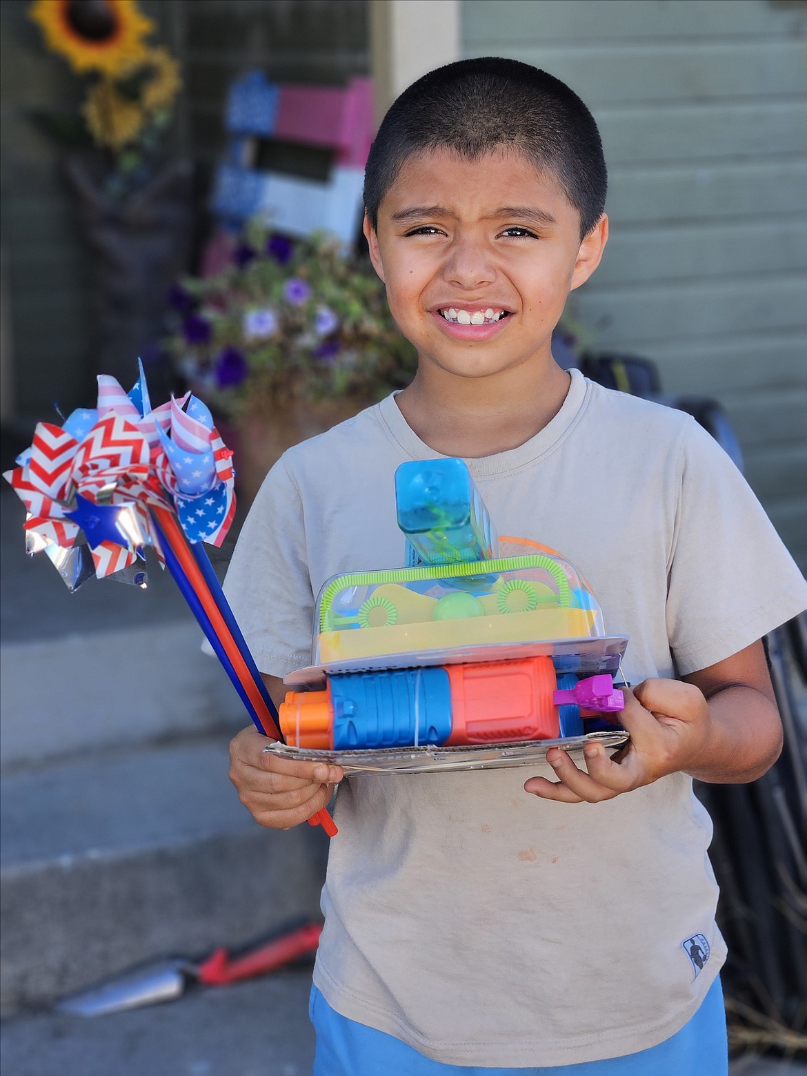 Nine-year-old Dean Wilson of Moses Lake took third place in the County the Candy contest at the Grant County Fair, and came away with a Bubble Blaster, a Nerf gun and a lighted bubble dispenser.