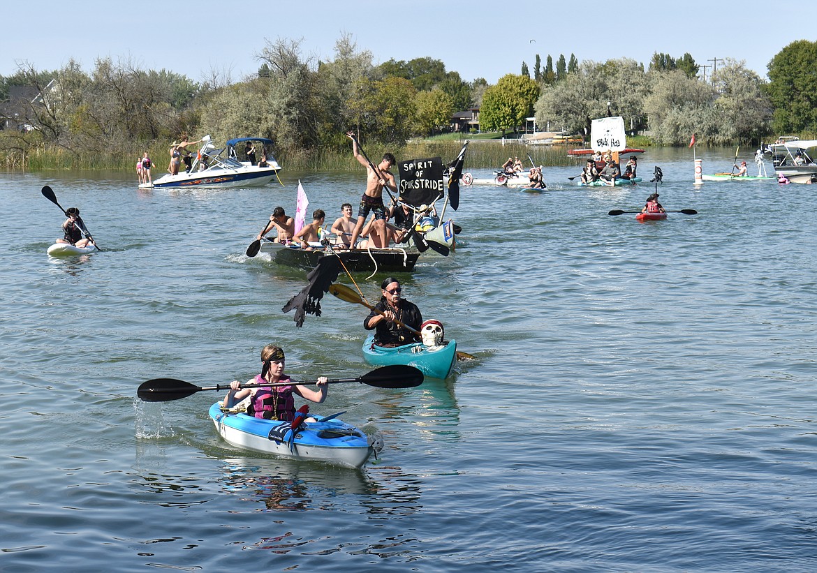 Weekend buccaneers in boats of all shapes and sizes yo-ho-ho their way around the course at the Camas Cove Cellars Pirate Regatta in Moses Lake Sunday.