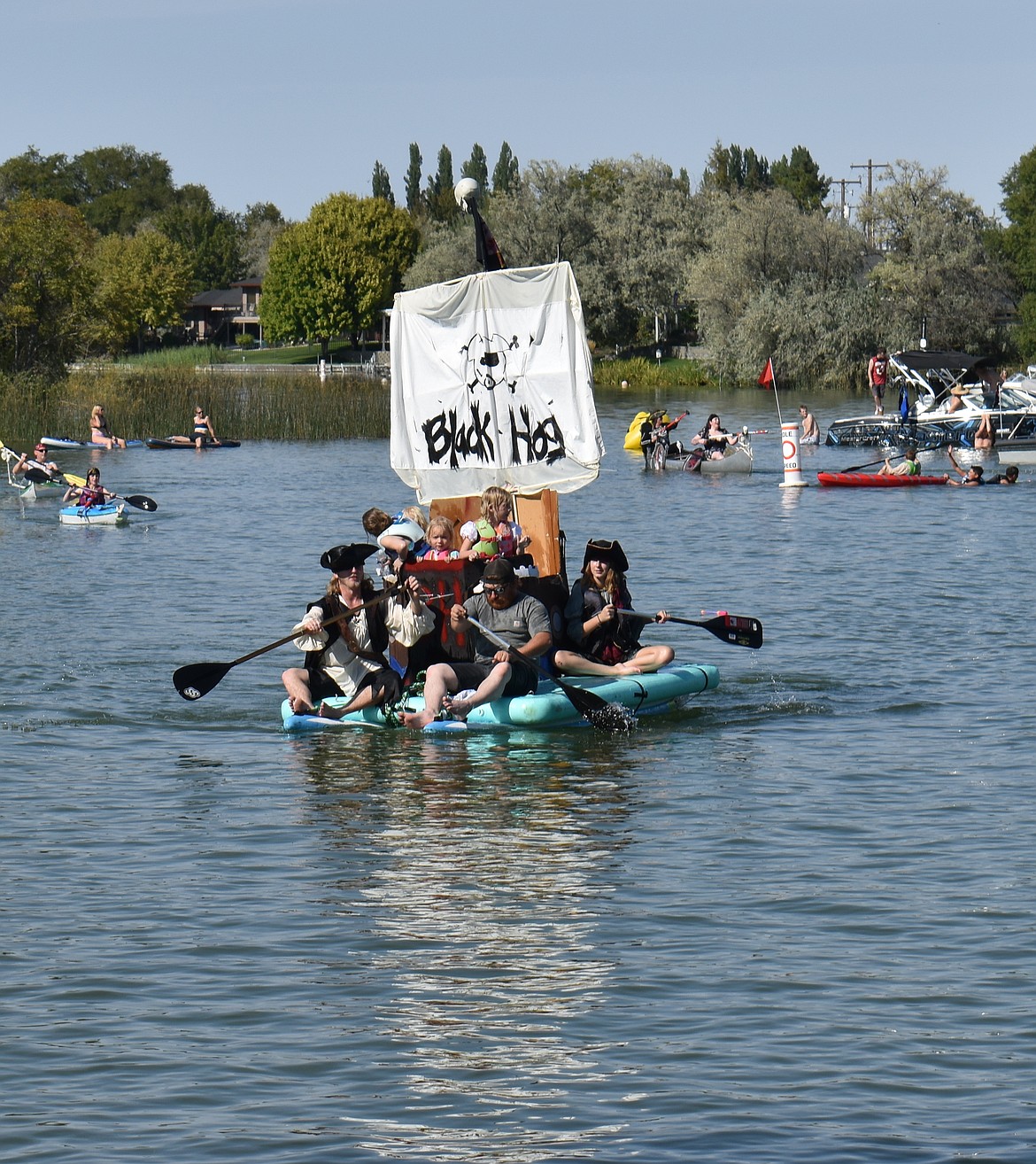 The Black Hog, one of 21 entries in the Camas Cove Cellars Pirate Regatta, looks like it could go under at any minute, but the crew made it around the course unswamped.