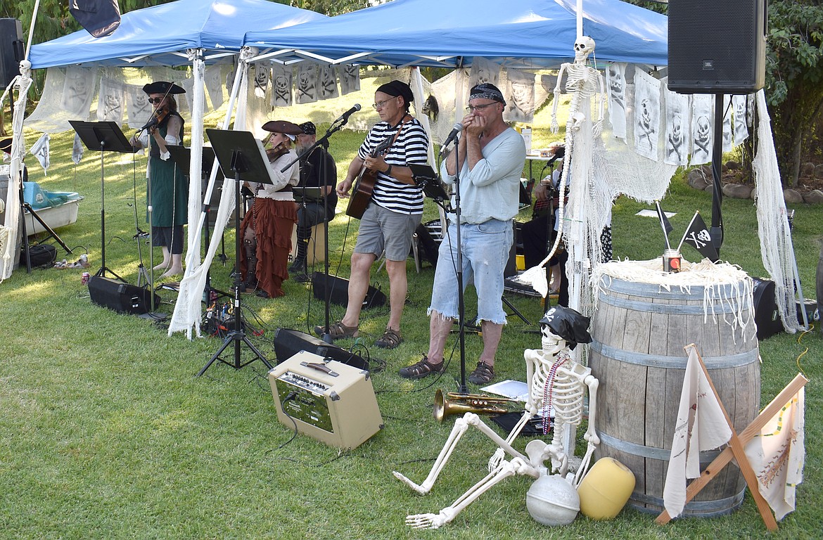 The Seven Cs Pirate Band plays at the Camas Cove Cellars Pirate Regatta Sunday. From left: Anna Birge-Carter, Mary Conway, Clifford Bresee, Jim Hamm and Steve Close. Obscured behind Close is Stacy Bresee.