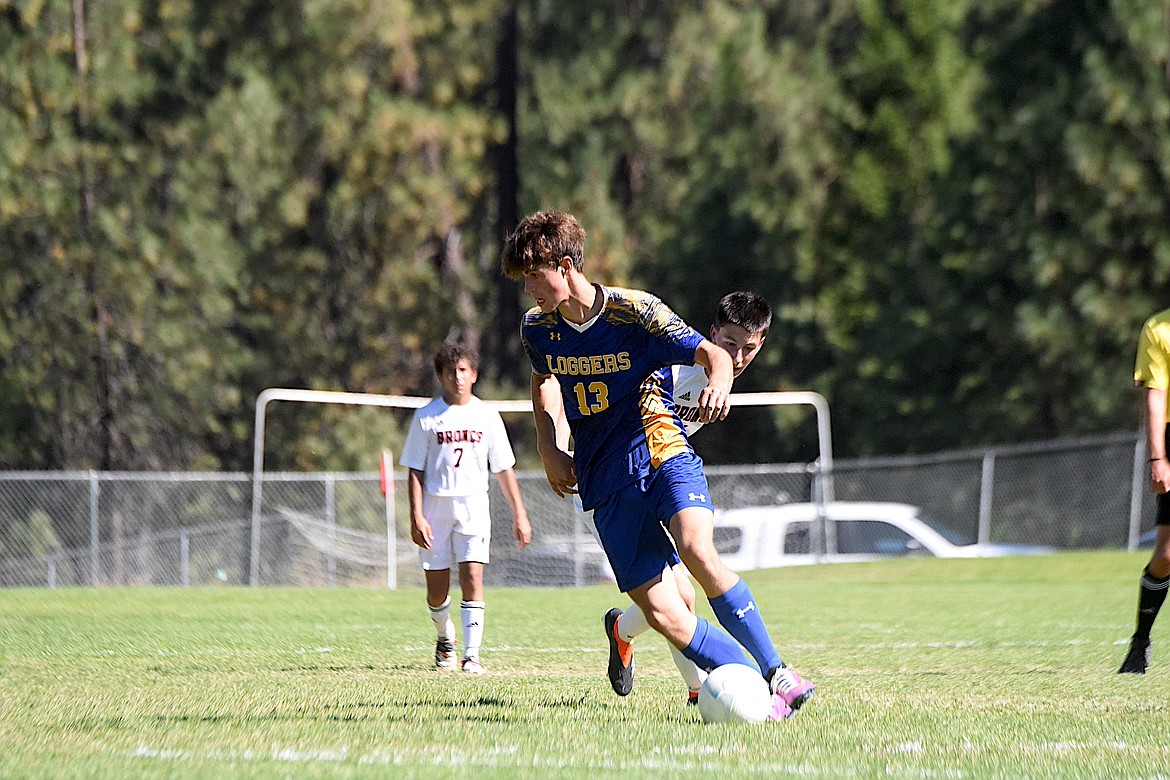 Libby's Dylan Warner evades a Frenchtown player during their game Saturday, Aug. 31, 2024. Warner scored a goal in Libby's 6-1 win. (Scott Shindledecker/The Western News)