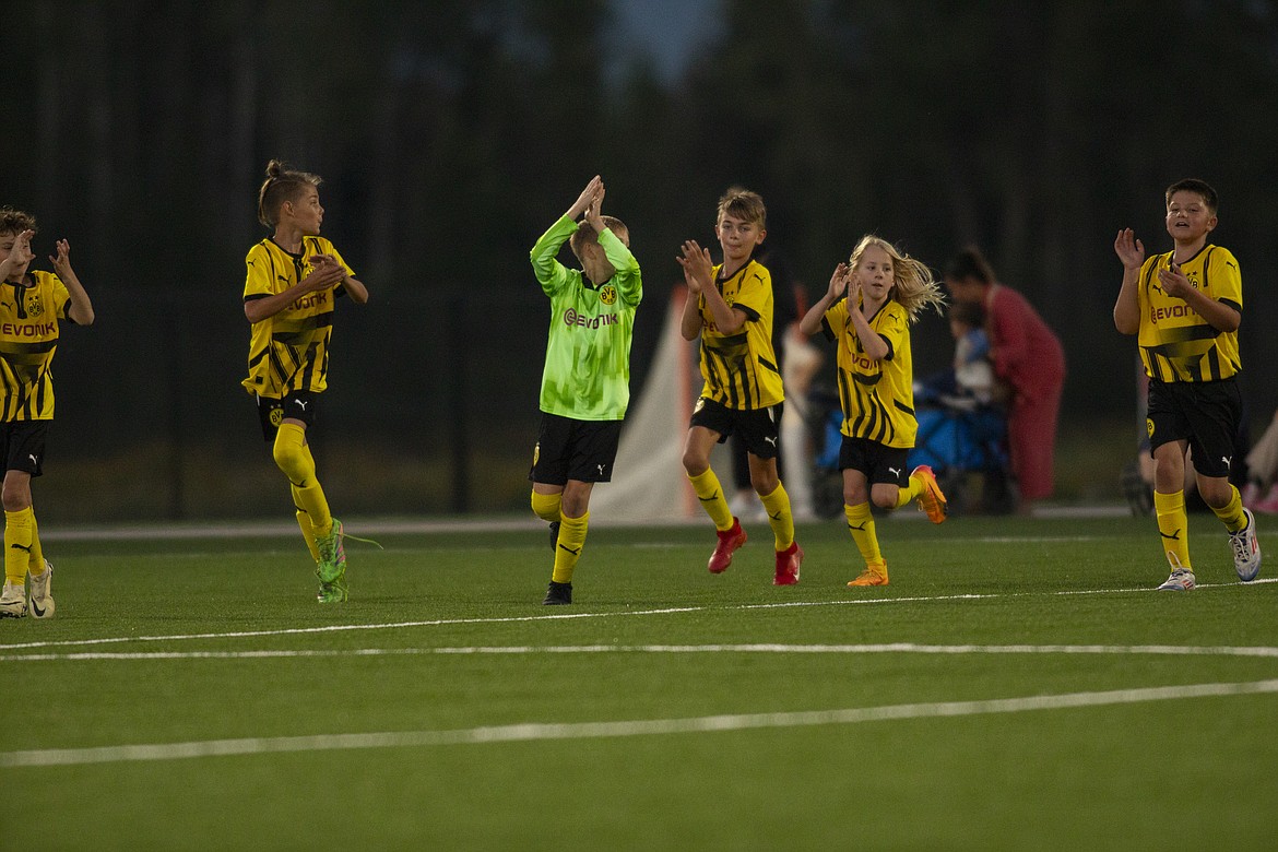 Photo by CHAD RILEY
Members of the BVB International Academy boys U11/12 team clap to their fans after a friendly against the ALBION SC Idaho of Sandpoint last Thursday at the grand opening of the Field of Dreams complex in Ponderay.