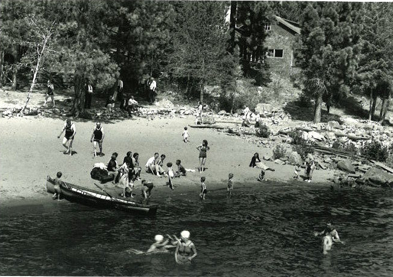 The Ferris family was happy to share its Lake Coeur d'Alene waterfront property with friends who often visited for summer beach parties, like the one photographed here in the mid-1930s.