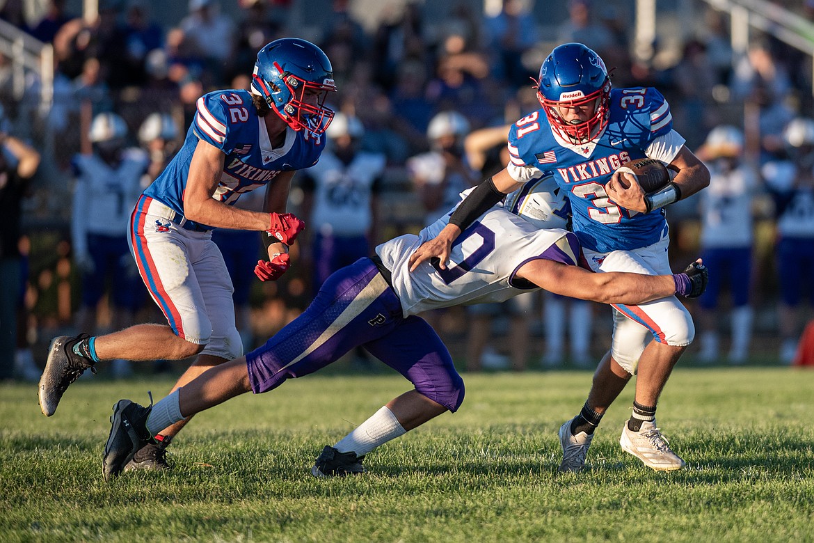 Treker Hickey dodges a tackle playing Polson Friday. (Avery Howe/Bigfork Eagle)