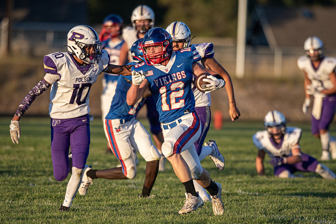 Sam Plummer runs the ball for the Vikings Friday playing Polson. (Avery Howe/Bigfork Eagle)