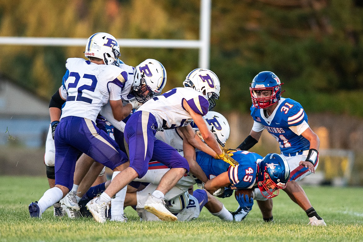 Noah Pandina (45) tries for a little extra yardage for the Vikings Friday, Aug. 30. (Avery Howe/Bigfork Eagle)