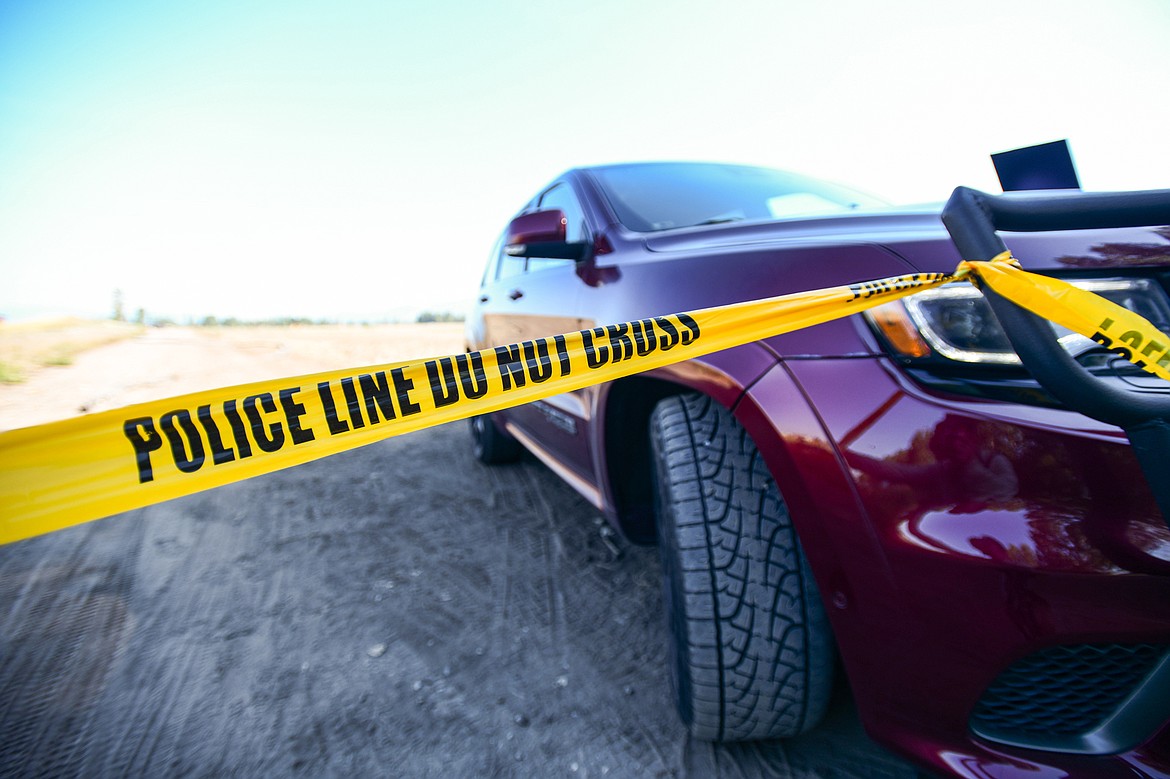 Police tape stretches across a lane along Sullivan Crossroad after a shooting incident on Wednesday, Sept. 4. (Casey Kreider/Daily Inter Lake)