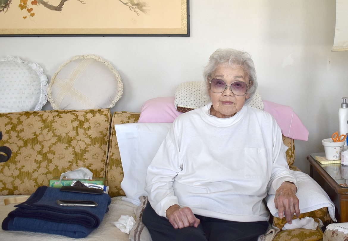 Miyo Koba, who turns 100 today, sits in the living room of the house she’s lived in since 1952 behind Frank’s Market.