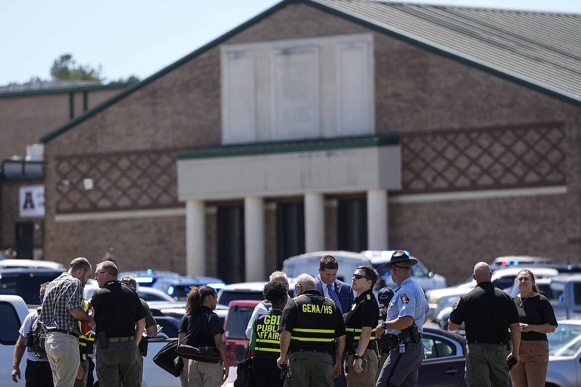 Police gather outside Apalachee High School after a shooting at the school Wednesday, Sept. 4, 2024, in Winder, Ga. (AP Photo/Mike Stewart)