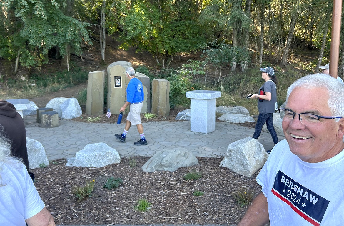 David Groth smiles as he passes by the Dwight Bershaw memorial area during the Dwight Bershaw Memorial .5K walk at McEuen Park on Saturday.