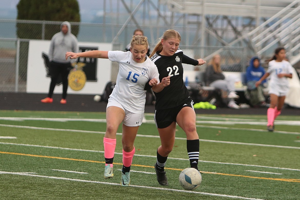 Royal forward Audrey Bergeson, in black, advances toward the net during a game last fall.