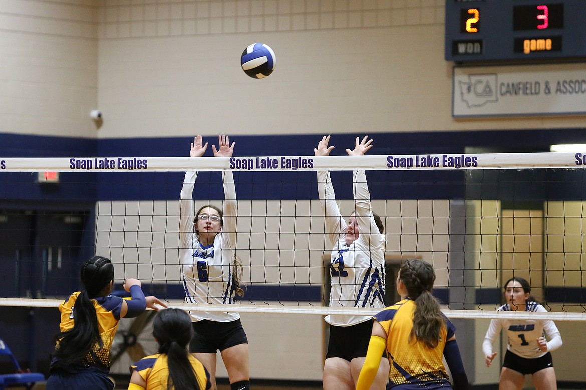 Soap Lake blockers rise to attempt to block the ball during a game in 2023. The Eagles qualified for the 1B State Volleyball Tournament for the first time in 32 years last season.