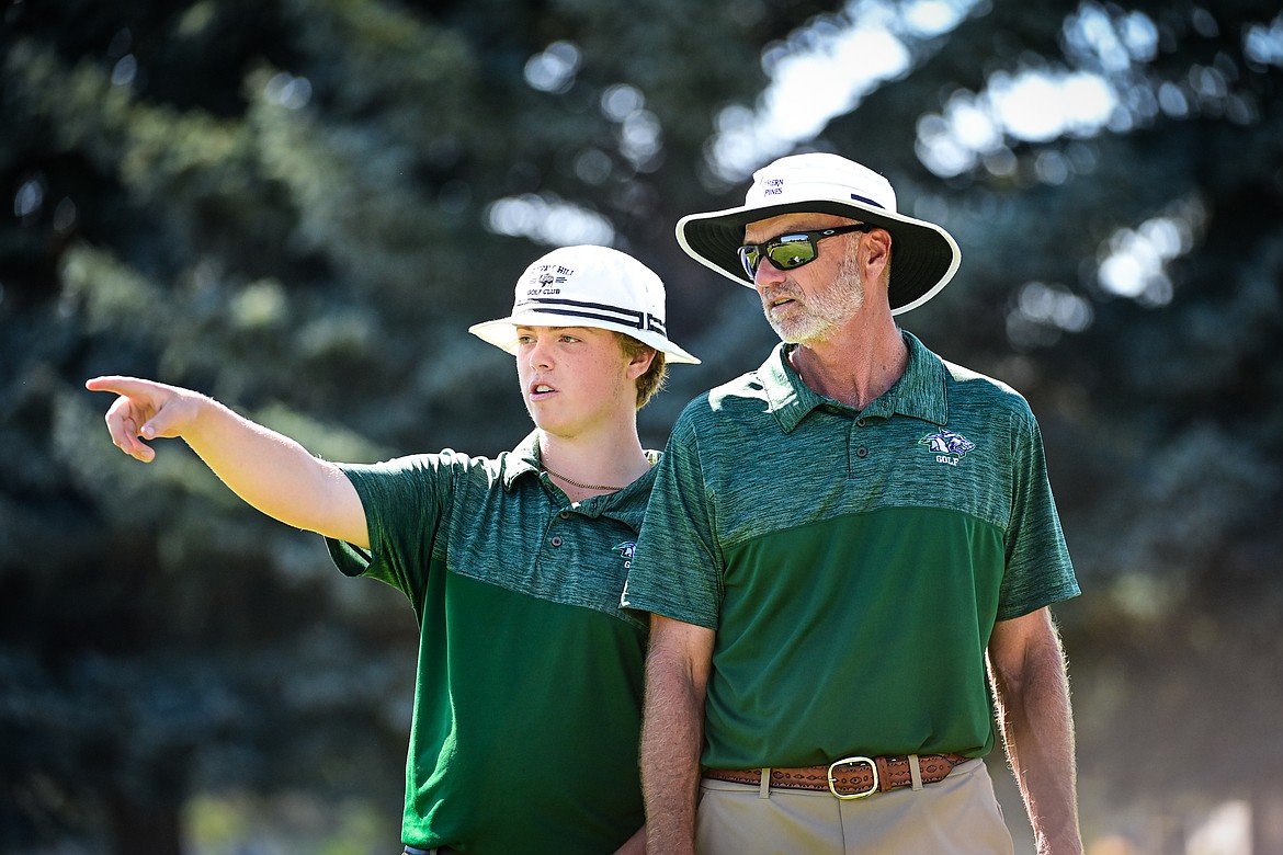 Glacier High School head golf coach Jim Ness talks with Tanyen Murray during the Crosstown Cup at Village Greens on Thursday, Sept. 5. (Casey Kreider/Daily Inter Lake)