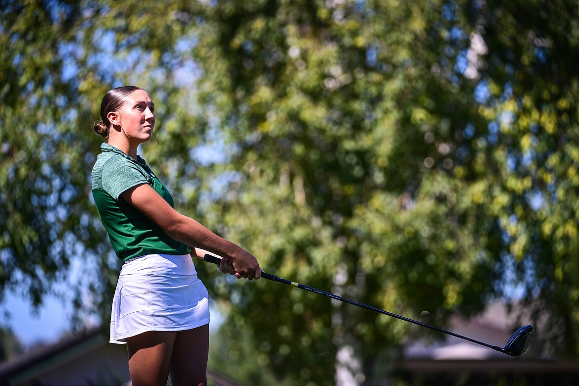 Glacier's Kendall Tkachyk watches her drive off the first tee during the Crosstown Cup at Village Greens on Thursday, Sept. 5. (Casey Kreider/Daily Inter Lake)