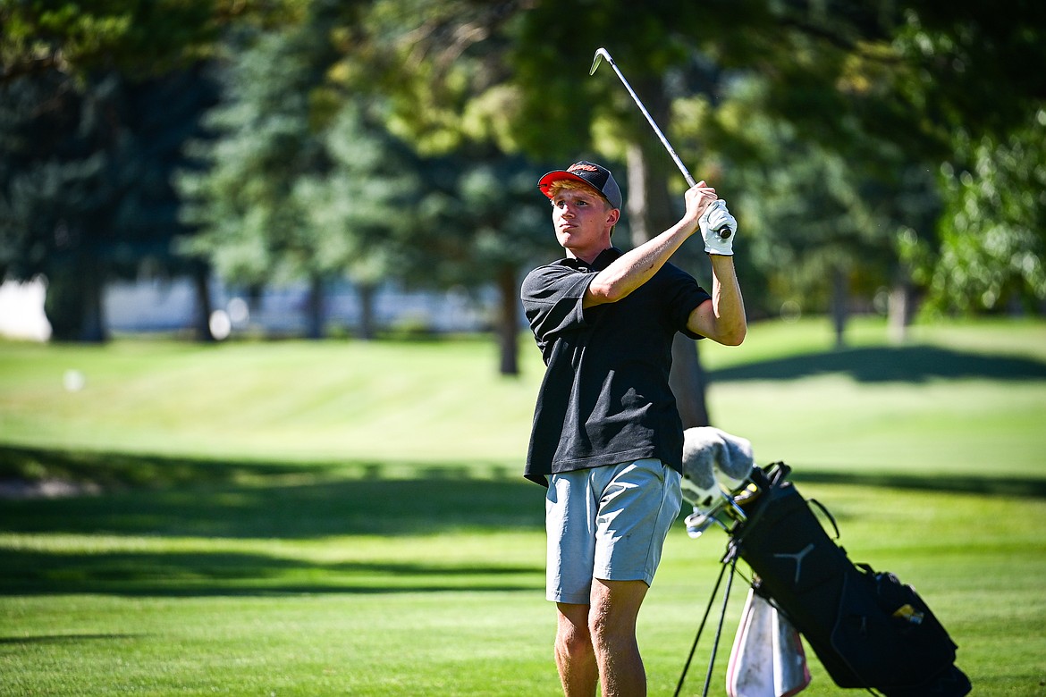 Flathead's Korbin Eaton pitches onto the first green during the Crosstown Cup at Village Greens on Thursday, Sept. 5. (Casey Kreider/Daily Inter Lake)