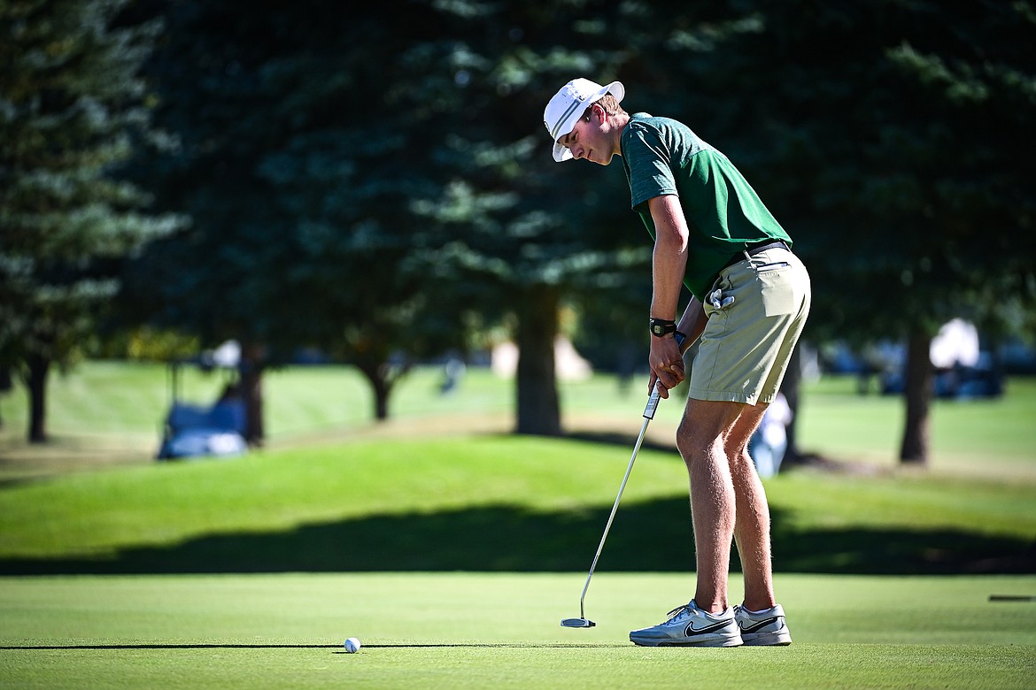 Glacier's Sam Engellant knocks in a putt on the second green during the Crosstown Cup at Village Greens on Thursday, Sept. 5. (Casey Kreider/Daily Inter Lake)